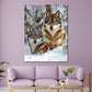 Due lupi nella neve tra gli alberi quadro