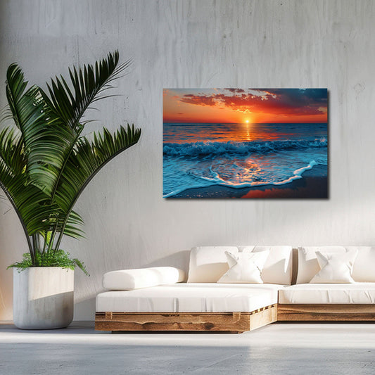 Cielo rosso al tramonto sul mare con onde e spiaggia quadro